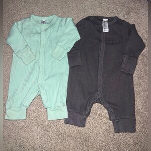 2 newborn onesies, they have hand mittens and are Capri legs with buttons.